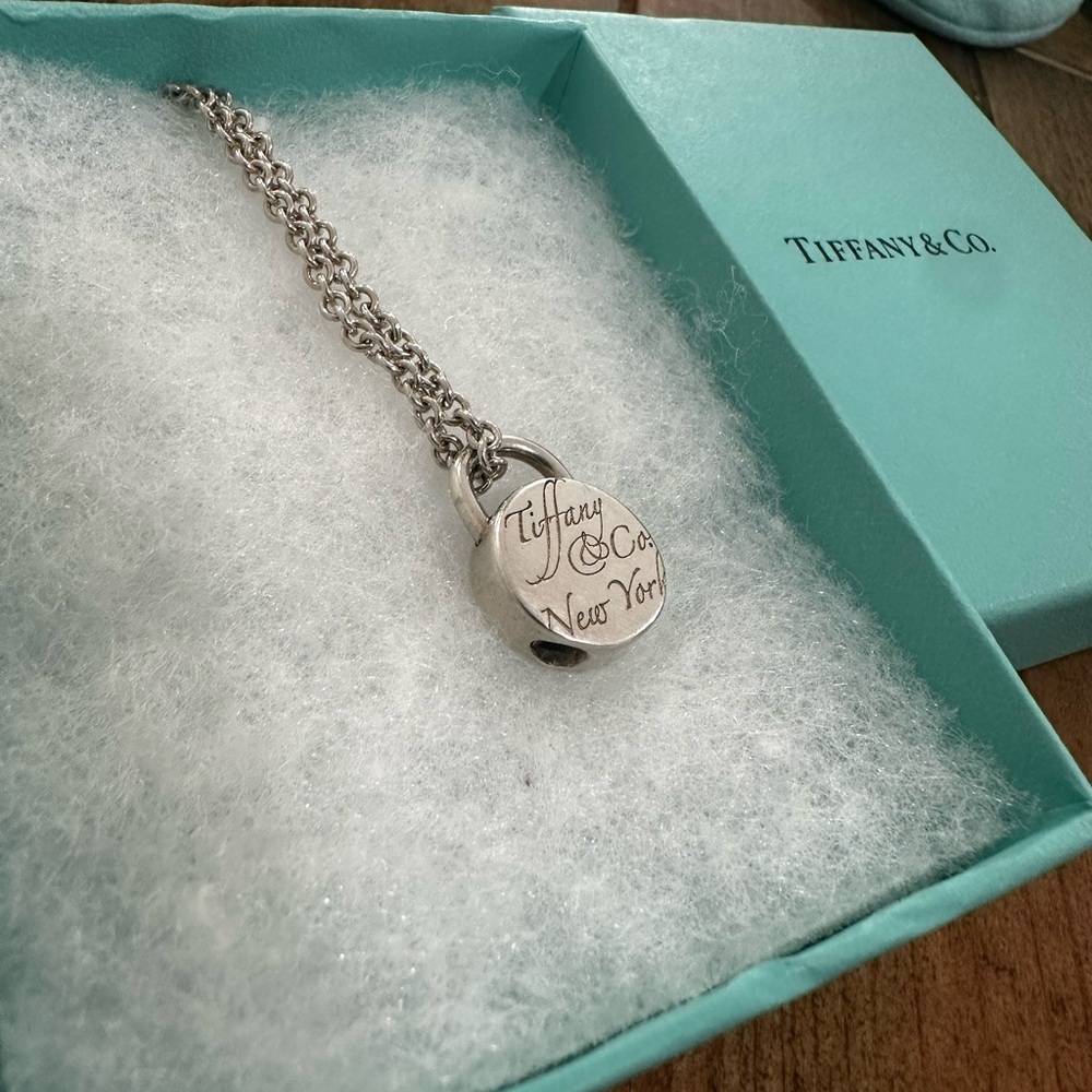 Tiffany & Co round lock necklace with original chain